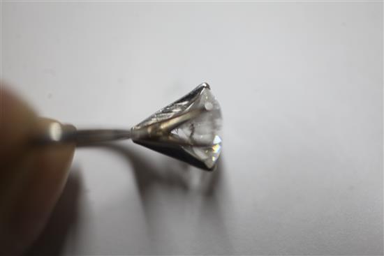 A platinum and solitaire diamond ring